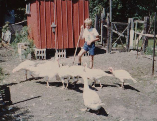 Young Andrew with farm animals